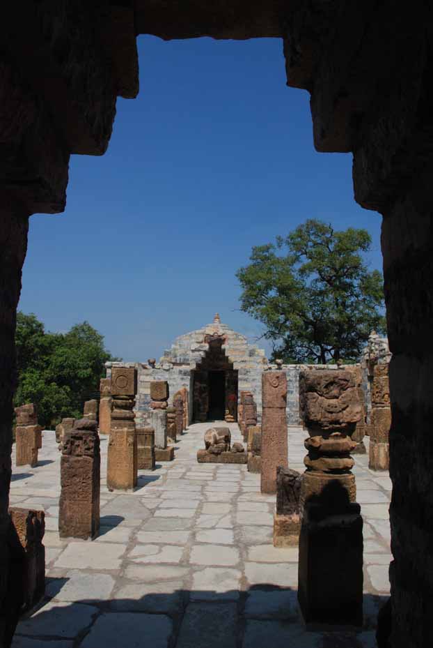 View of the terrace from inside one of the shrines with the row of pillars visible.